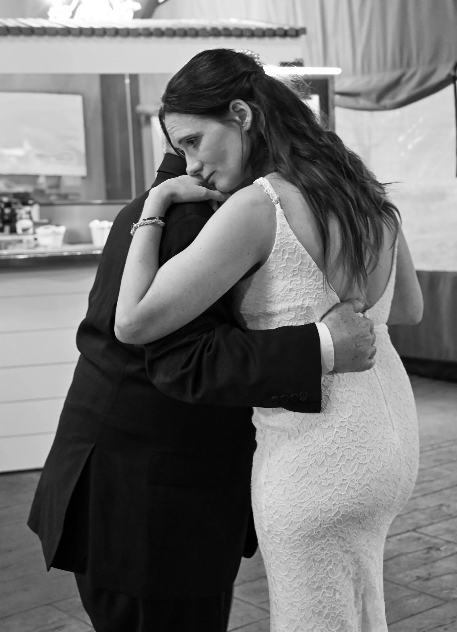 Bride and groom embracing during their first dance — Amy Minikus Photo + Film